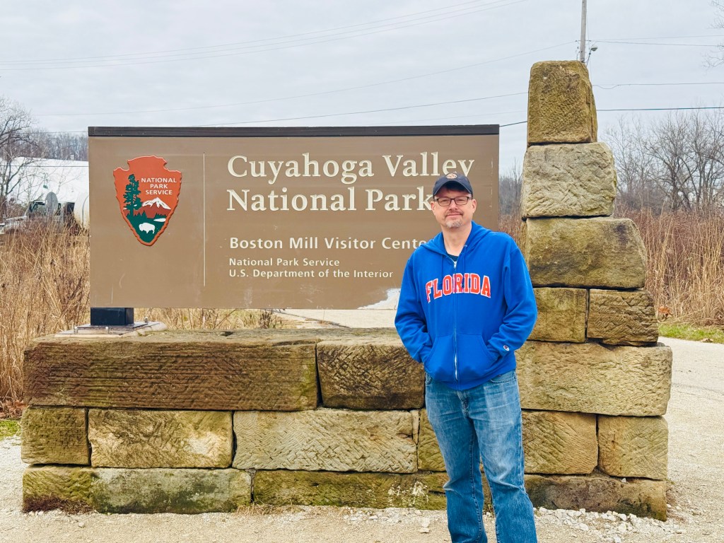 Donald standing in front of the Cuyahoga Valley National Park sign